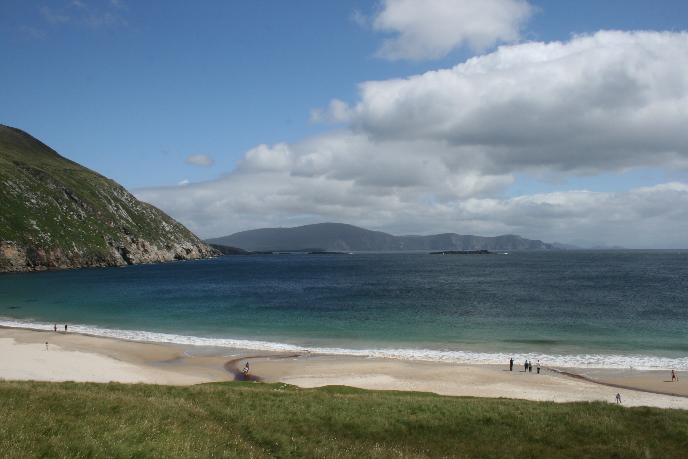 The sheltered turquoise water and rugged green headlands of Keem Bay on Achill Island