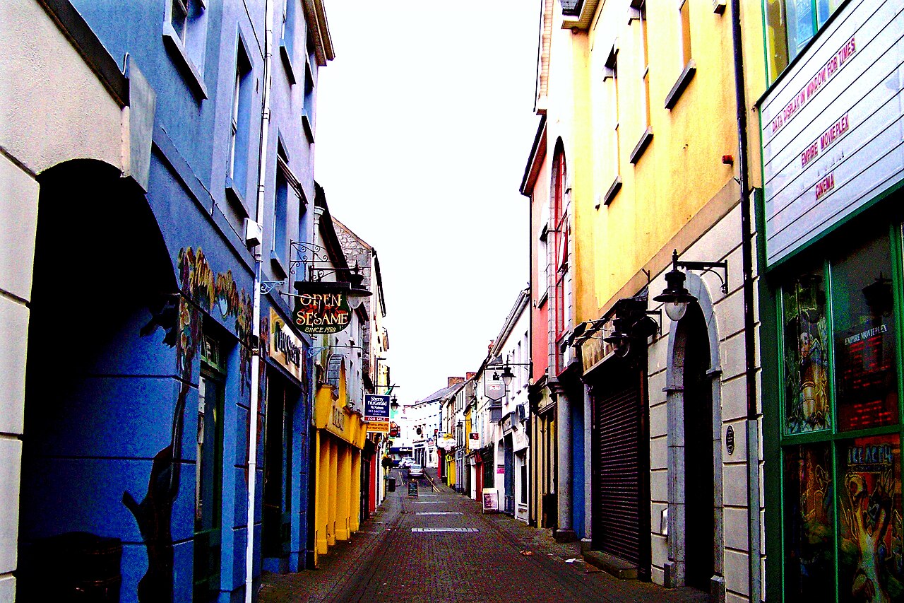 Colourful shopfronts along Parnell Street looking towards High Street in Ennis, County Clare
