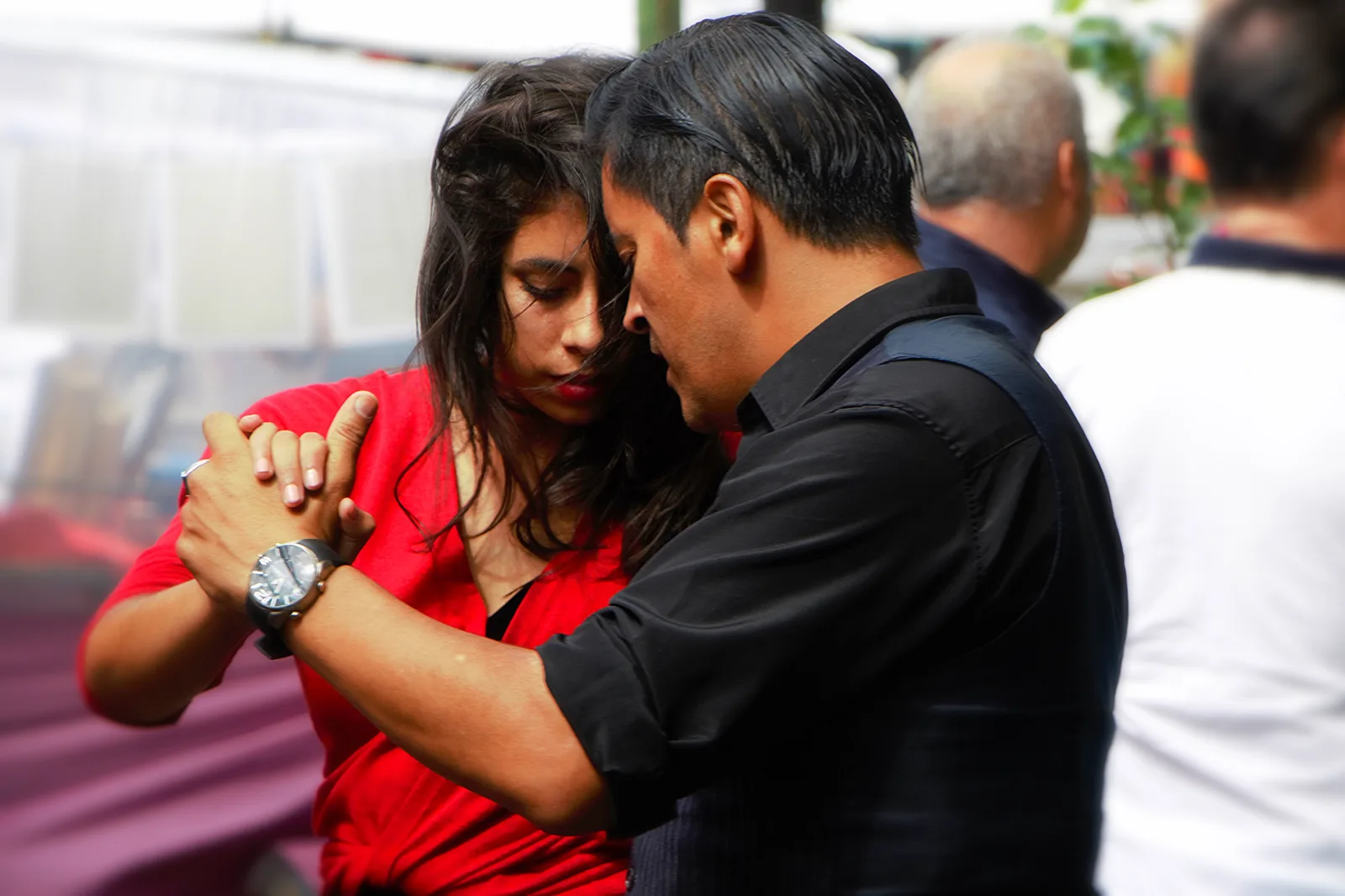 A couple in a close tango embrace in La Boca, Buenos Aires