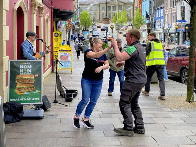 A couple Jiving to a street musician on High Street in Omagh.