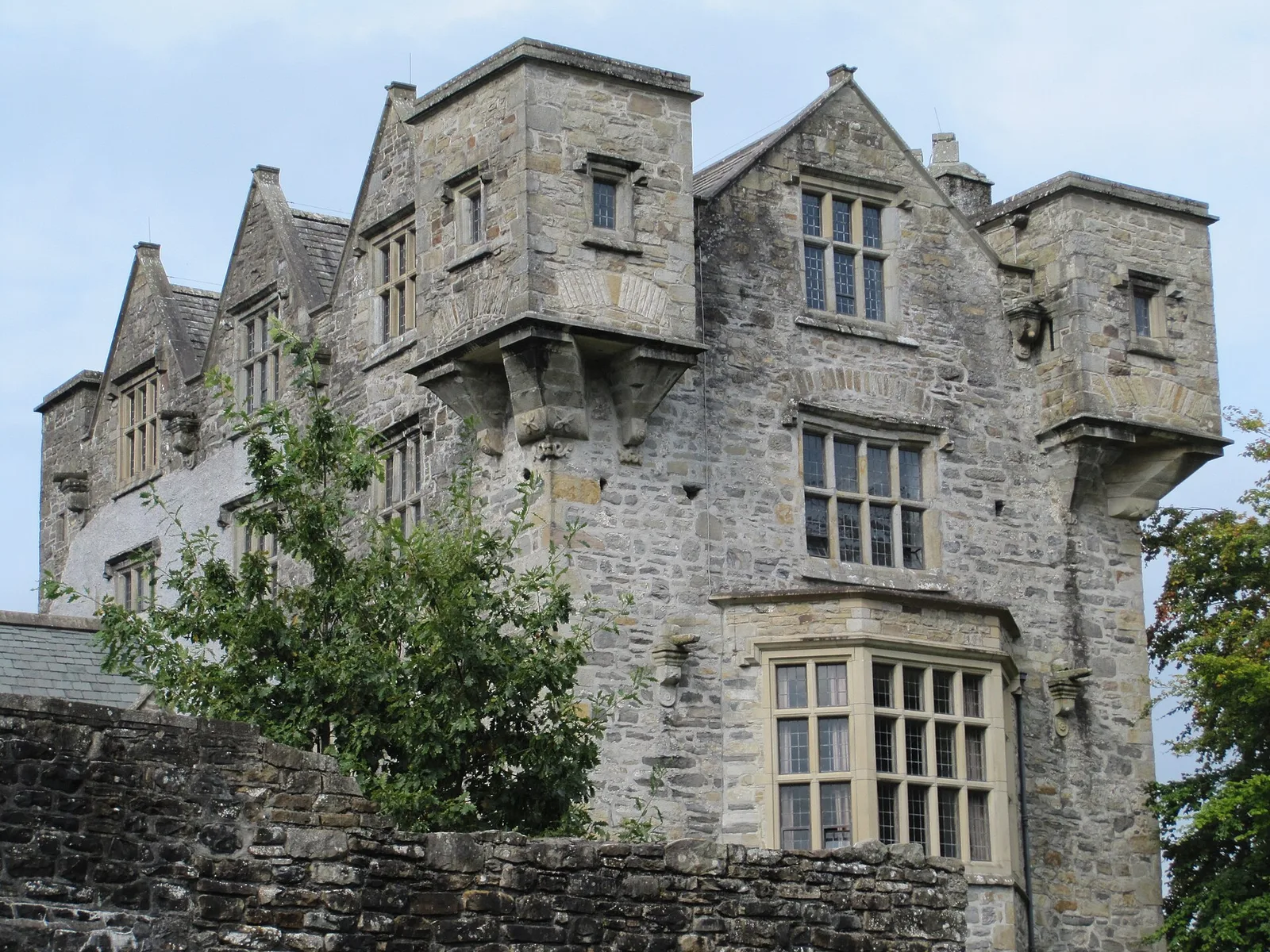 The stone tower house and mullioned windows of Donegal Castle.
