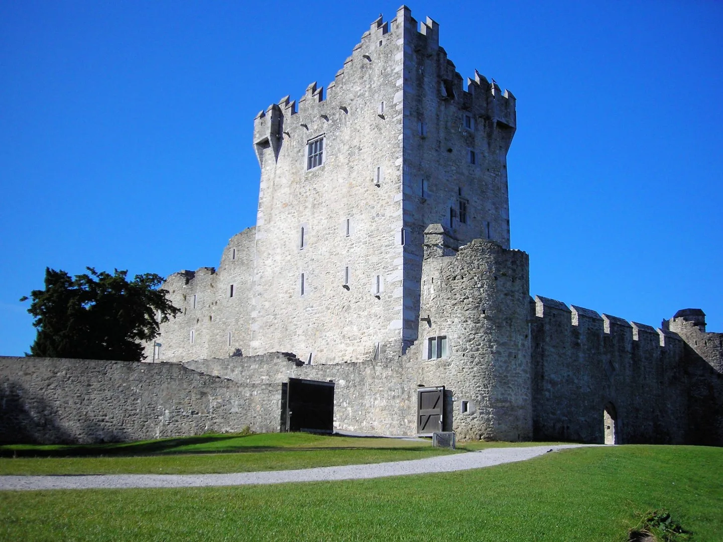 Ross Castle above lawns beside Lough Leane in Killarney National Park.