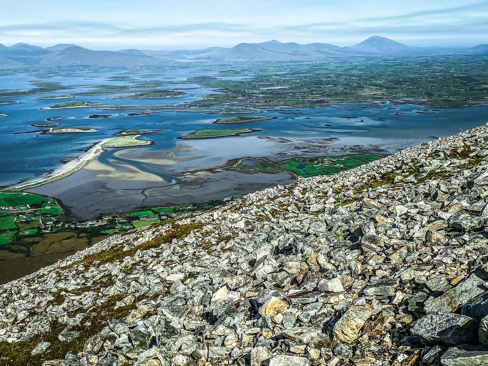 Clew Bay dotted with green islands, viewed from Croagh Patrick.